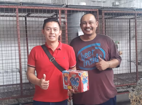 A happy family with the parrot they took home from Mysher Aviary